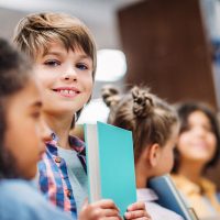 adorable-little-kids-with-books-in-school-library-2024-11-18-19-18-15-utc